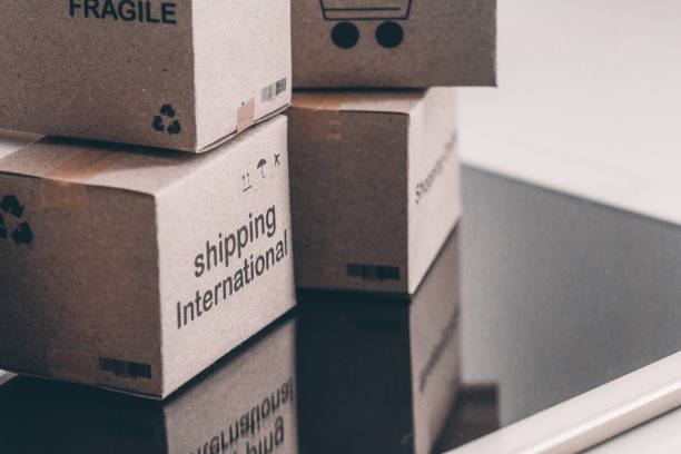 istock Idea of shopping online and service / e-commerce concept. Stack boxes on laptop for Customer can buy from electronic internet. 998460446
