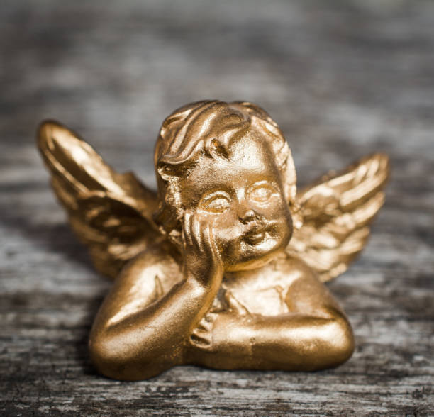 istock Beautiful little gold angel 998460542