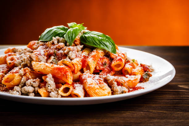 istock Penne with tomato sauce and pork 998460646