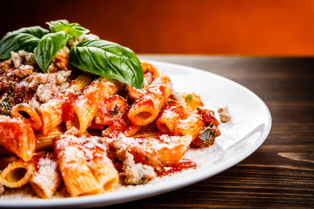 istock Penne with tomato sauce and pork 998460740