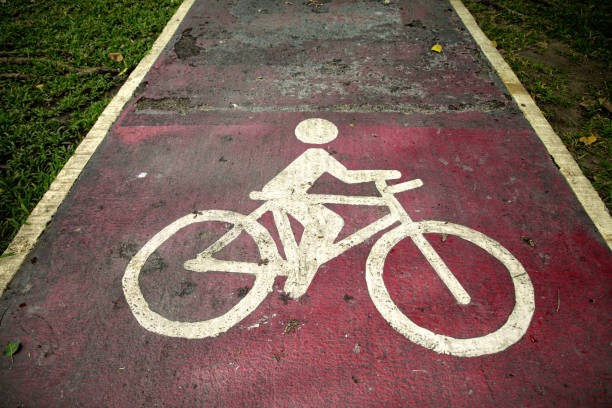Conceptual image of close up bicycle sign on public park road