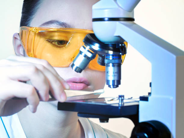 istock Young beautiful girl lab assistant in a laboratory 998468492