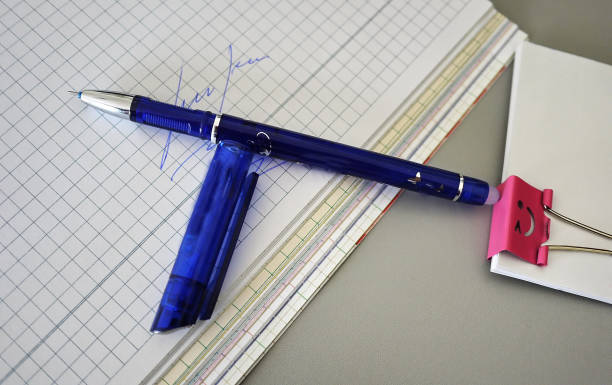 istock Multi-colored pens beautifully laid on the writing table. Order and perfectionism available. 998476218