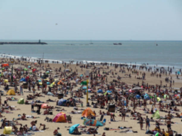 istock People At Seashore Scene During The Day 998496606