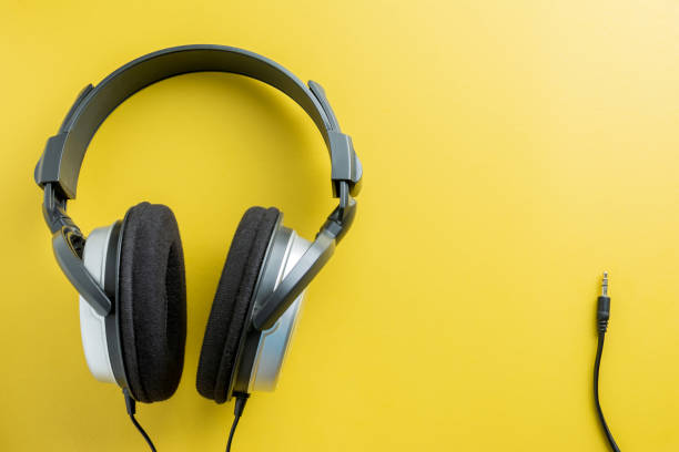 istock Stereo Headphones on Yellow background. copy space for text. 998502048