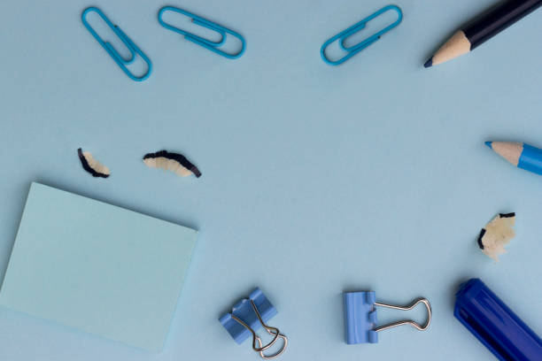 istock back to school or office styled concept, frame with blue school supplies on blue background 998502210