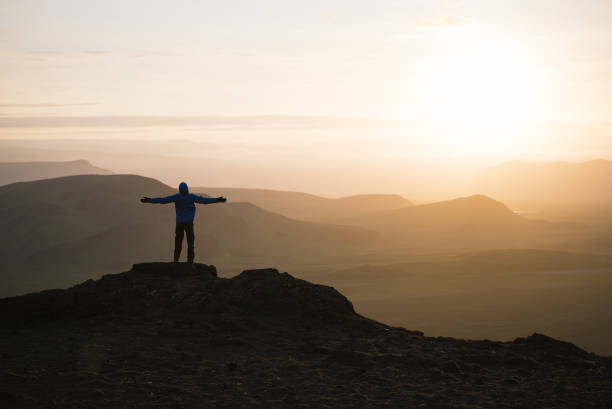 istock Tourist at sunrise in the mountains 998502418