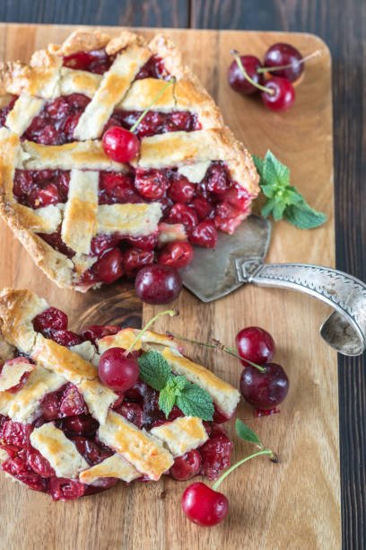 istock Cherry pie on the wooden board 998505606