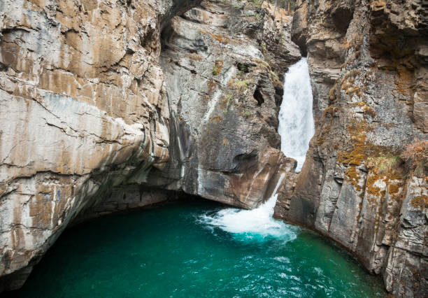 lower falls at johnston canyon in the canadian rocky mountains, alberta, canada - lower falls imagens e fotografias de stock