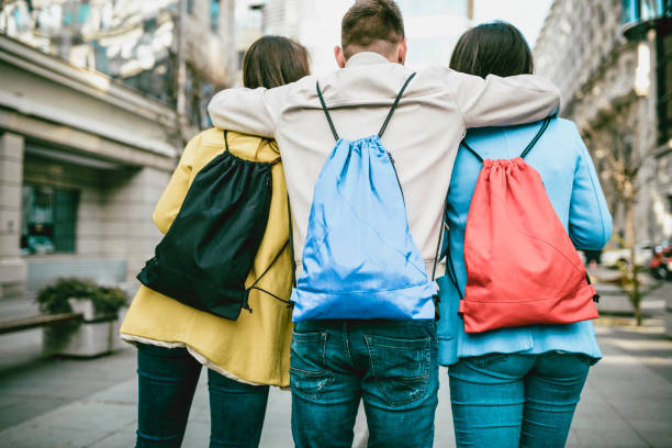 istock Three High School Friends Walking Through City Square After School 998512580