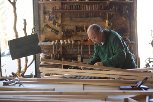 istock Senior carpenter working with wood 998513282