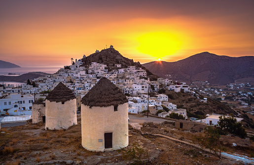 Traditional houses, wind mills and churches in Ios island, Cyclades, Greece.