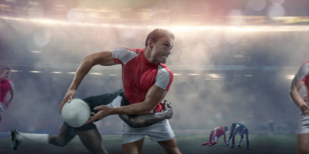 istock Rugby Player About To Pass Whilst Being Tackled During Match 998520096