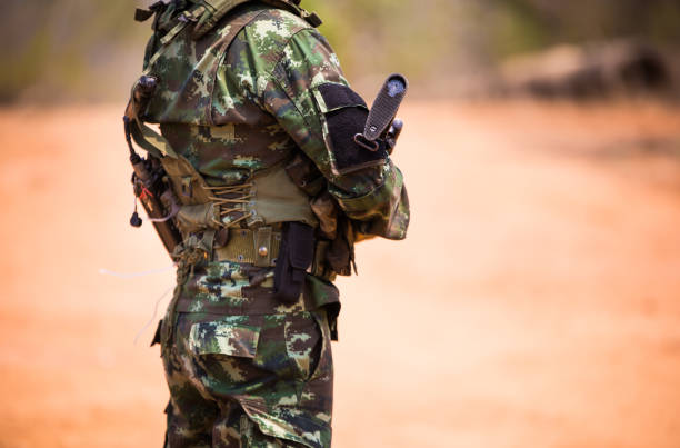 istock Midsection Of Army Soldier Standing On Field 998524512