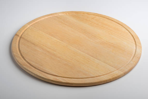 istock Isolated round wooden chopping board 998566522