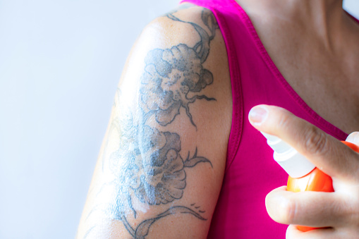 Woman Tattoo arm horizontal