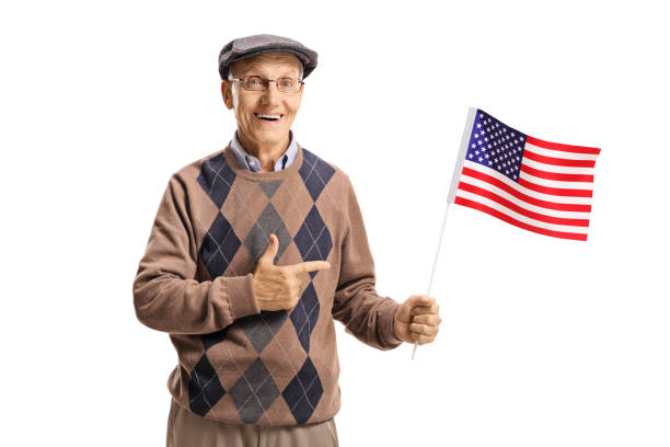 istock Senior holding an American flag and pointing 998582378