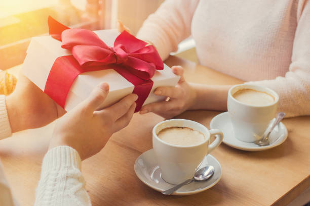 istock Romantic man giving present to his girlfriend 998587188