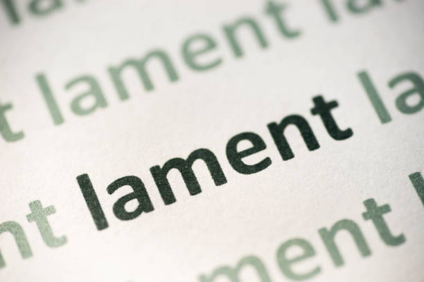 istock word lament  printed on paper macro 998588216
