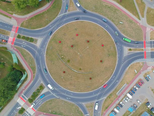 istock Roundabout intersection in five directions with island, aerial view 998594468