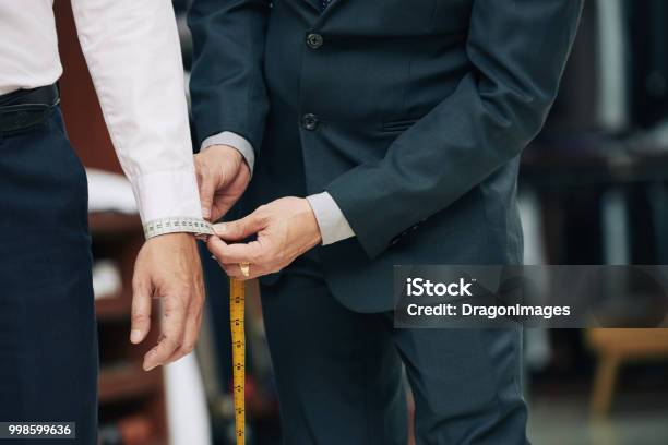 Measuring Cuff Stock Photo - Download Image Now - Tailor, Suit, Customized