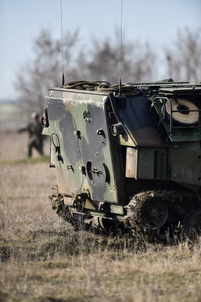 istock Amphibious tank caterpillars are seen on a war field 998616554