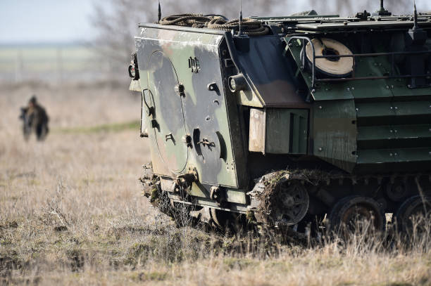 istock Amphibious tank caterpillars are seen on a war field 998616576