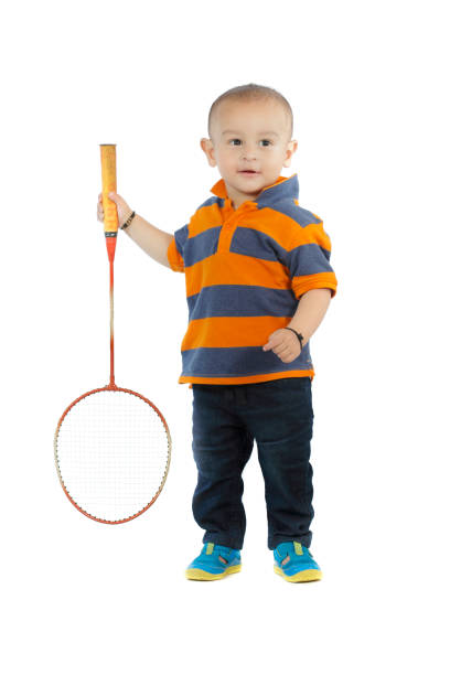 istock baby boy playing with badminton racket 998621158