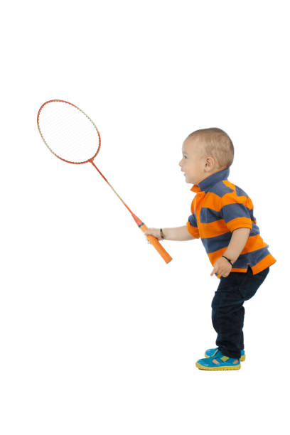 istock baby boy playing with badminton racket 998621238