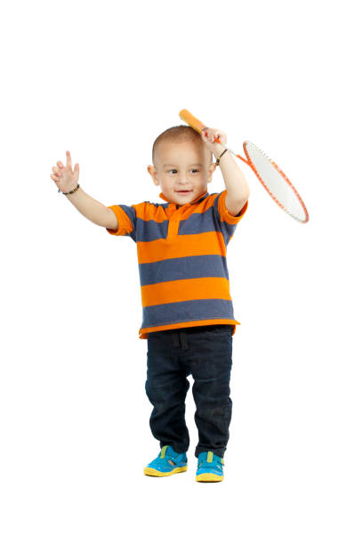 istock baby boy playing with badminton racket 998621514