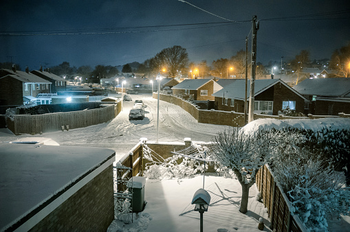 Snow Covered Suburban Scene At Night In The UK