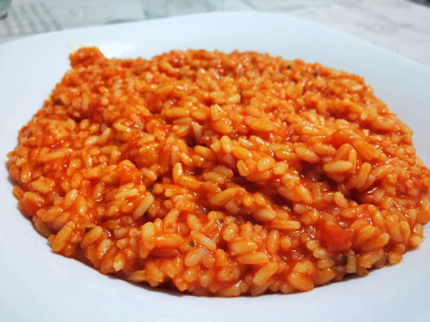 istock Italian risotto with tomato sauce 998642786