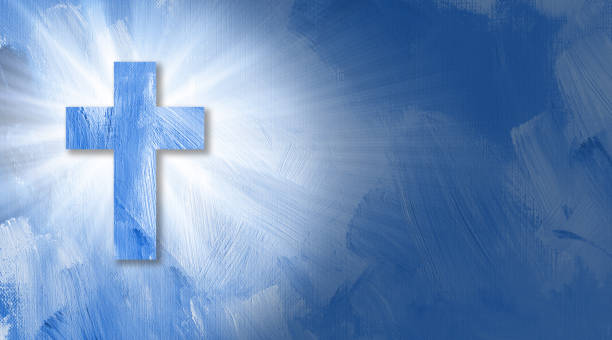 istock Christian cross with glowing rays of light graphic background 998648328