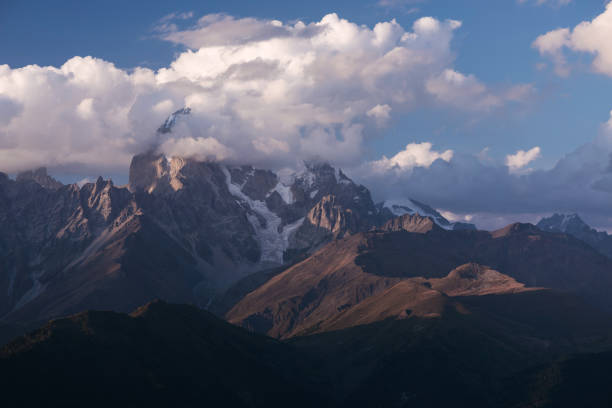 istock Beautiful mountain peak in the clouds 998655866