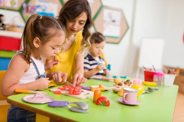 istock Childs are playing with play clay in classroom. 998667782
