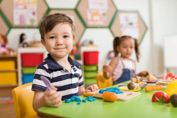 istock Childs are playing with play clay in classroom. 998667976