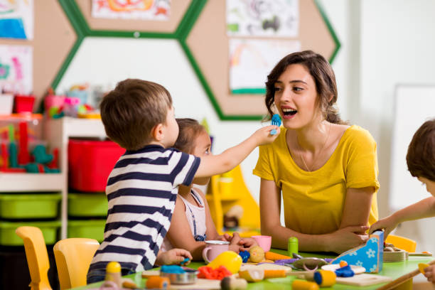 istock Childs are playing with play clay in classroom. 998670534