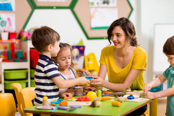 istock Childs are playing with play clay in classroom. 998670610
