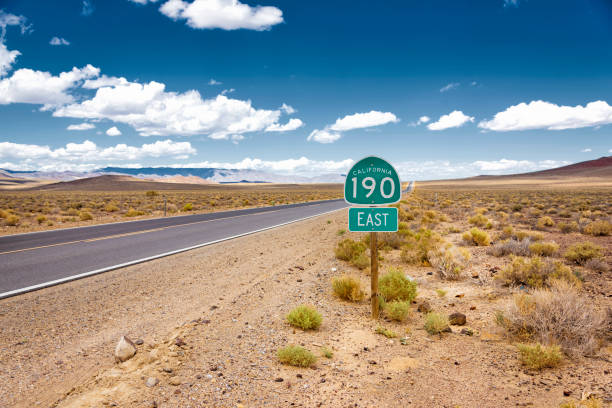 istock Road sign next to highway in Death Valley 998681852