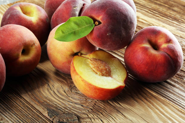 istock A group of ripe peaches on table 998684324