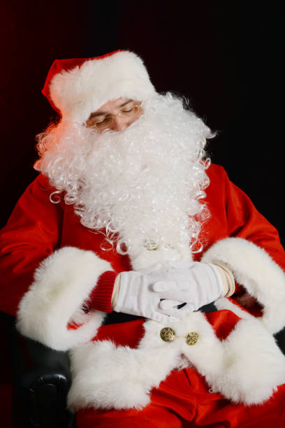 istock Sleepy Santa Claus taking a nap 998691670