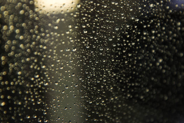 istock Raindrops Water Drops Texture Backgrund Window Glass Selective Focus 998698946