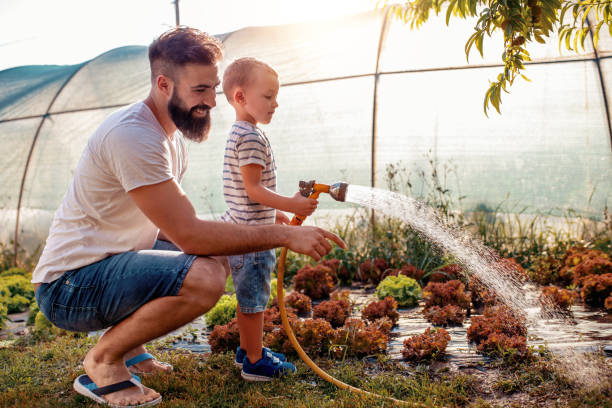 istock Father and son in garden 998715700
