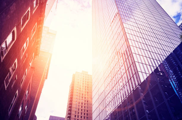 istock Looking up at Manhattan skyscrapers at sunset. 998716082