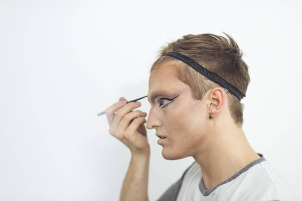 istock Man gets dressed in drag attire in bathroom 998732556