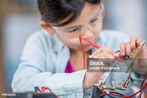 Working With Circuits Stock Photo - Download Image Now - Brown Hair, Canada, Care