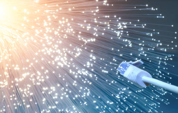 istock Futuristic technological background, closeup on the end of optical fiber network cable 998773030