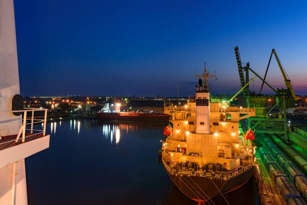 istock Blue summer dusk in sea port 998790082