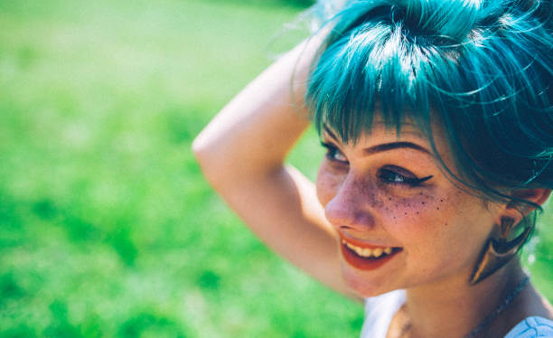 istock Girl with green hair 998801100