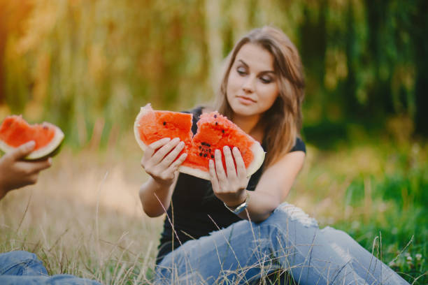 istock girls with watermelon 998818938